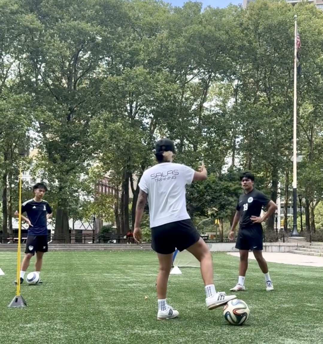 Teenagers playing soccer